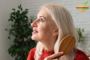 woman combing hair after regrowth